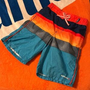 GERRY - Boys, small, fits 7-8 year olds
Swim trunks are Yellow, orange,and  blue